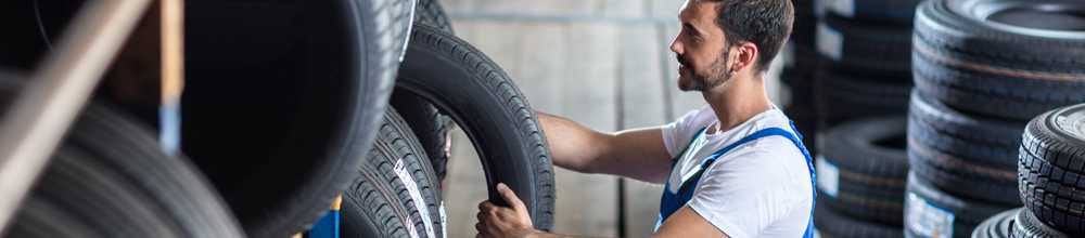 Technician selecting from a stock of tyres - Tyres Banbury